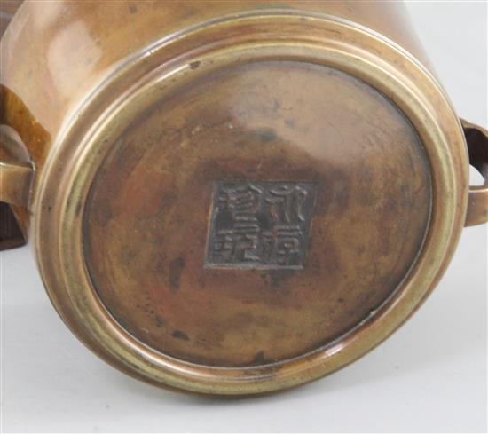 A rare Chinese Ming cylindrical bronze censer, 16th / 17th century, diameter 11cm, wood stand